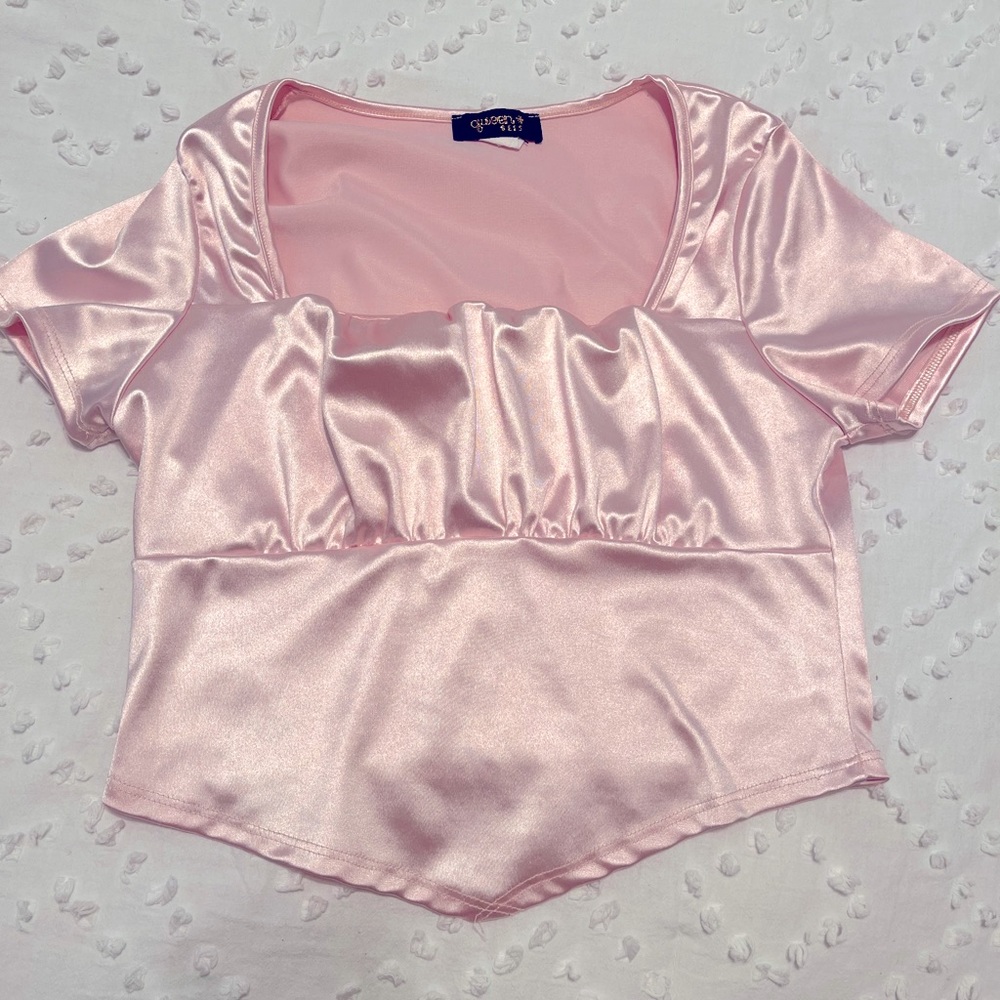 Selling a silky pink shirt, for a casual look.